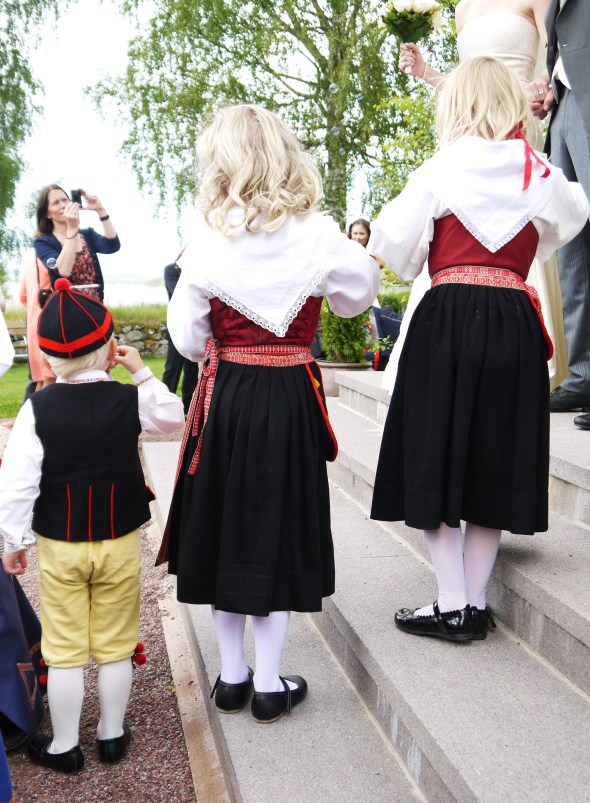 It is a Swedish custom that for a special celebration such as a wedding the family wears their traditional clothing. Each dress is made specific to reflect the town/village and heritage they originate from.